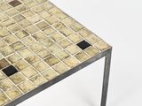 a small table with a tile top and metal legs
