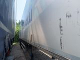 two trains that are parked next to each other on the tracks