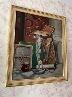 a painting on the wall of a room with a painting on the wall