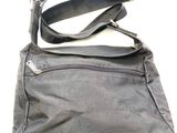 a close up of a black purse with a zipper on it