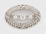 a diamond and gold broochle