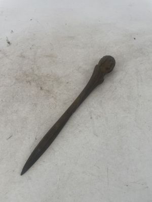a small knife that is laying in the snow