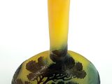 a glass vase with a painting of a tree on it