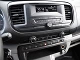 a car dashboard with a clock and radio in it