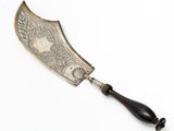 an antique silver plated knife with a black handle on a white background