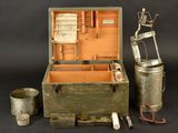 a small wooden box with a metal container and a pair of scissors