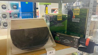 a display case with a black bowl on it in a store