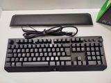 a black keyboard and mouse on a white table