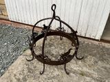 a metal ring on the ground near a building