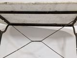 an image of a white marble table with a black iron frame