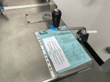 a machine that has some papers on it