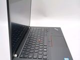 a laptop with a black keyboard on a white surface