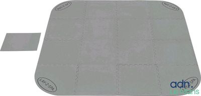 a close up of a gray mat on a white surface