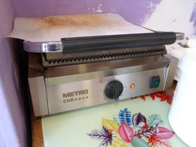 a pizza oven sitting on top of a counter