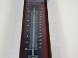 a thermometer in the box on the table