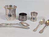 silverware and spoons on a white surface