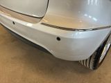 a white car that is parked in a garage