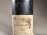 a bottle of wine that is sitting on a table