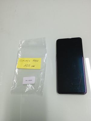 a black cell phone sitting next to a clear plastic bag
