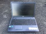 a laptop computer sitting on the ground on the ground
