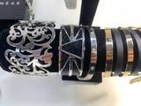 a close up of a black and silver bracelet and a black and gold bracelet