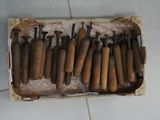 a lot of tools that are in a box on the floor
