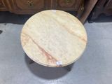 an image of a marble top table with a drawer in the background