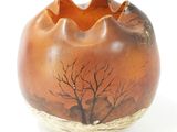 a brown vase with a picture of a tree on it