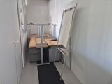 a room with a desk and a chair in it