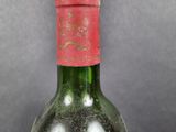 a bottle of wine that is sitting on a table