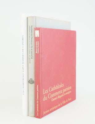 two books sitting on top of each other on a white surface