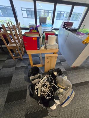a pile of electronics sitting on the floor in a room