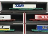 four train cars are stacked in a black box on a white background
