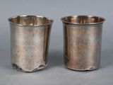 pair of antique silverplated cups with raised rims