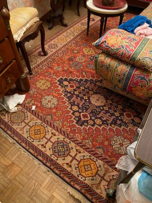an image of a living room with a rug on the floor