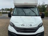the white van is parked on the side of the road