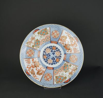 a blue and orange plate with a circular design on it