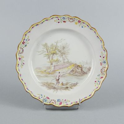une assiette avec l'image d'un homme et d'un chien