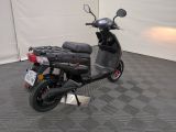 a scooter that is parked in a garage