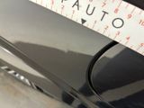 a measuring tape on the side of a car ' s door