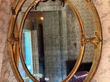 a mirror on the wall above a sink in a bathroom