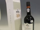 a bottle of wine sitting next to a box of wine