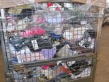 a metal cart with many items in it in a warehouse