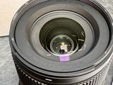 a camera lens sitting on a table next to a box