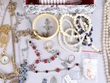 many different types of jewelry on the table
