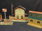 three toy buildings that are sitting next to each other
