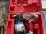 an image of a red tool box with a drill and hammer in it