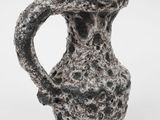 an image of a black and white vase on a white surface