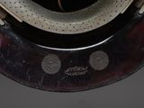 a close up of a helmet on a stand