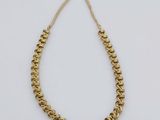 a gold chain necklace with a gold clasp on a white background